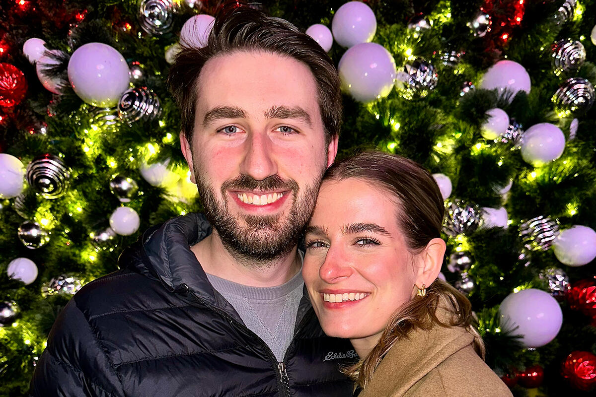 Rogers in front of tree.